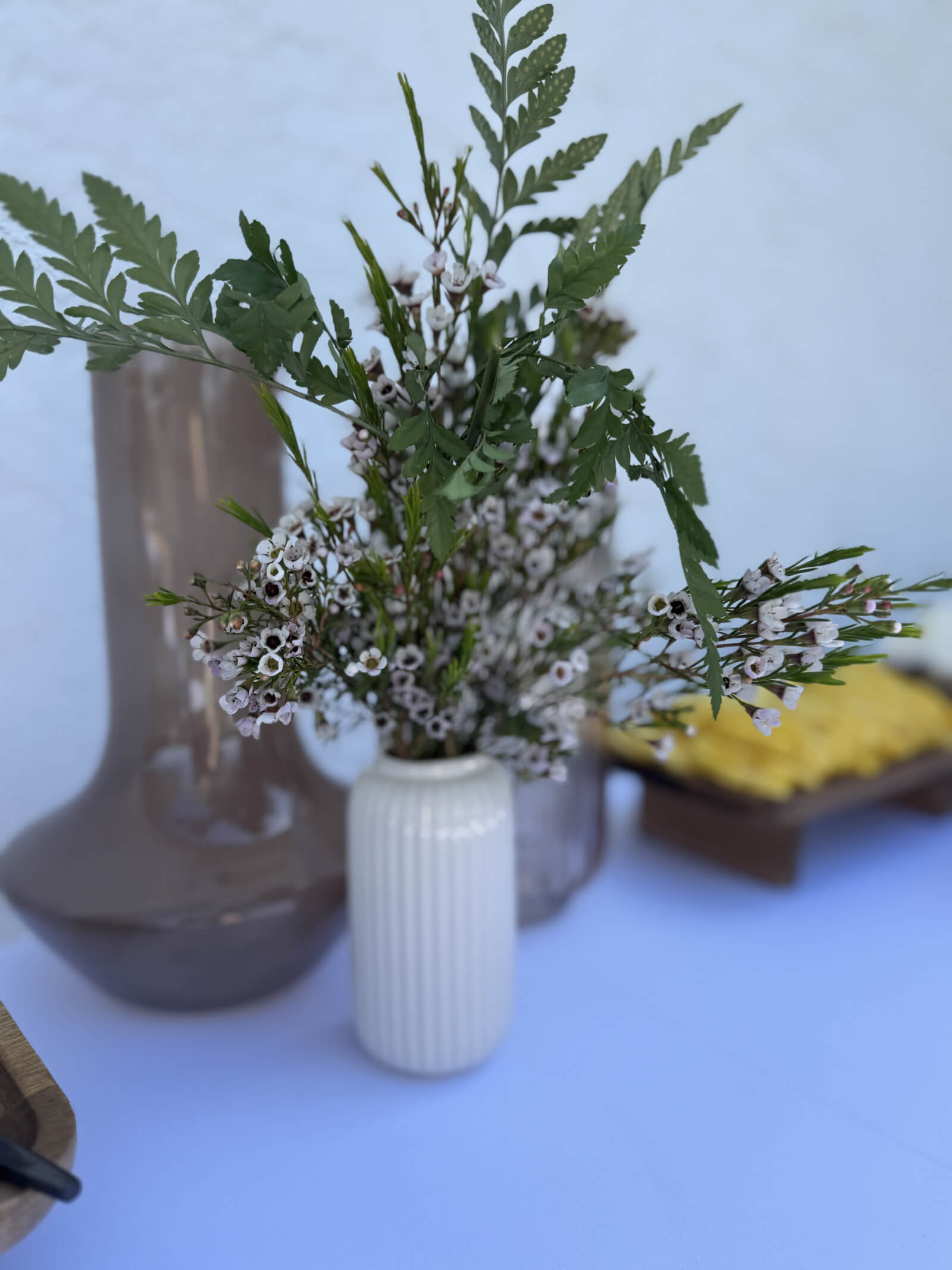 Brunch table styled with florals and warm light for a private gathering